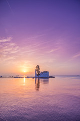Fototapeta premium scene of Vlacherna monastery at sunrise, Kanoni, Corfu