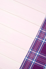 Purple towel over wooden table