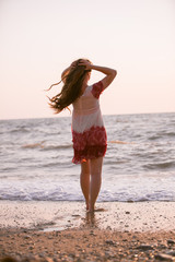 Woman with long hair on the beach