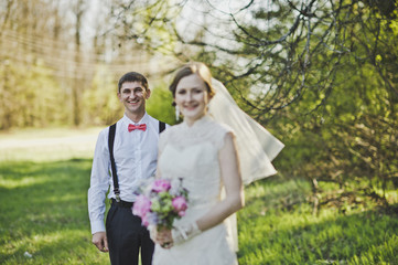 Newlyweds hugging on the background of the forest 3967.