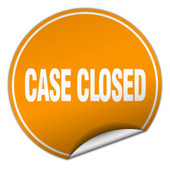 case closed round orange sticker isolated on white