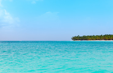 Fototapeta na wymiar view from the sea on a tropical beach and the island