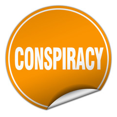 conspiracy round orange sticker isolated on white