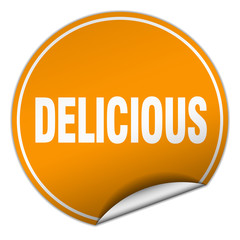 delicious round orange sticker isolated on white