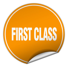 first class round orange sticker isolated on white