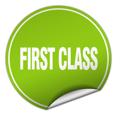 first class round green sticker isolated on white