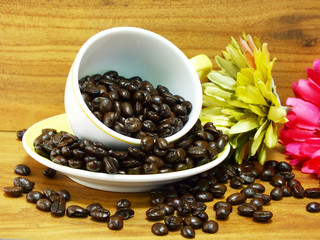 studio shot of coffee beans on wooden background still life