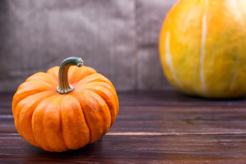 Two pumpkins lie on a table