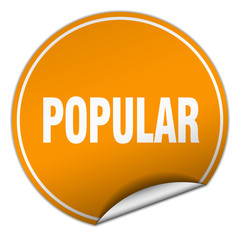 popular round orange sticker isolated on white