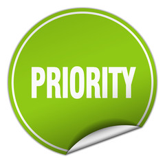 priority round green sticker isolated on white