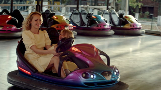 Crazy family drive on bumper cars