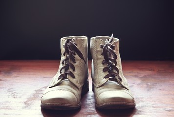 Brown leather shoes on  wooden floor