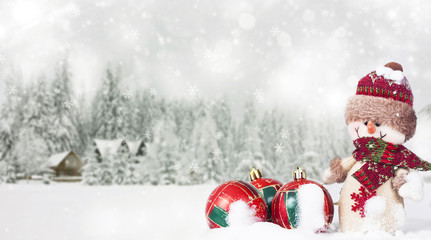 Christmas background with snowman in the snow
