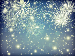 Abstract holiday background with fireworks and sparkling lights