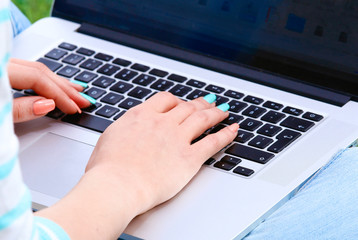 Business woman hands busy using laptop at office desk