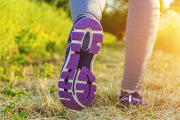Woman running in a field