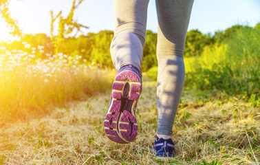 Woman running in a field