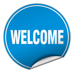 welcome round blue sticker isolated on white