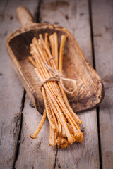 Breadsticks with sesame seeds.Crunchy snack to beer.