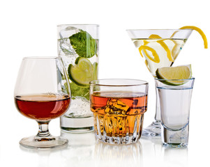 Various cocktails and alcohol on white background