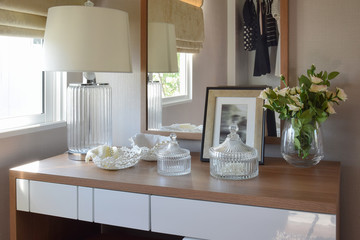 wooden table with jewelry set ,mirror,lamp in dressing room