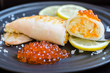 фаршированные кальмары на гриле  stuffed squid on the grill  © xenia100