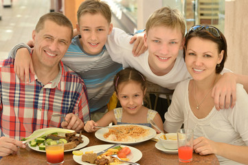 Happy family at breakfast