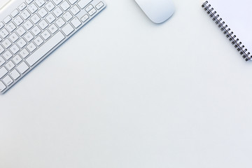 Office White Table with Computer Keyboard Mouse and Notepad Top View