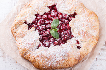 Homemade galette with cherries.selective focus