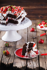 Chocolate cake with whipped cream and strawberries.selective focus