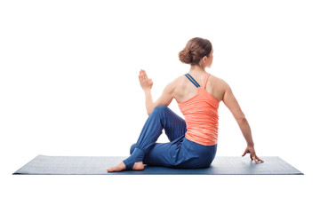 Sporty fit yogini woman practices yoga asana