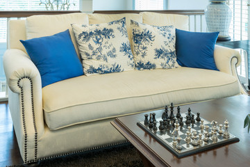 luxury living room with blue pattern pillows on sofa and decorat