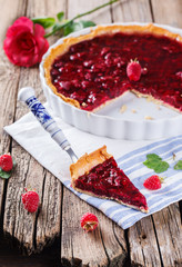 Tart with fresh raspberries in jelly fill.selective focus