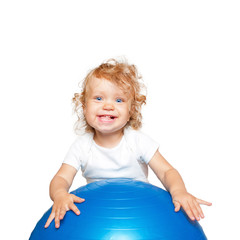 sportive baby playing with fitness ball.