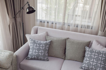 Pattern and texture pillows on beige sofa in the living room