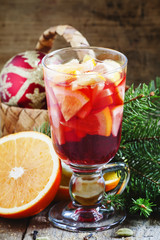 Christmas composition with mulled wine with orange, fir branches