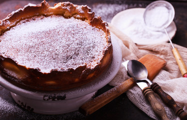 Flan at home, sprinkled with powdered sugar.selective focus
