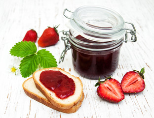 Strawberry jam and fresh strawberries