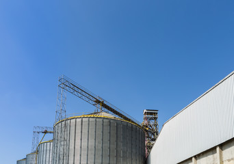 Beautiful blue sky and big tanks factory