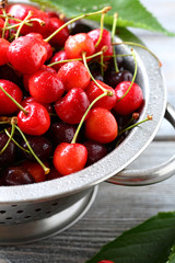 fresh cherries in colander
