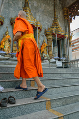 Thai monk walking in temple to worship