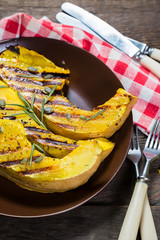 Slices of pumpkin with rosemary grilled