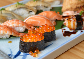 Salmon roe sushi (Ikura sushi) in sushi set, traditional Japanese food.
