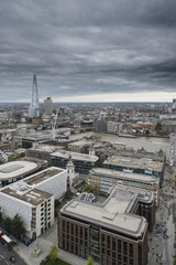 London city aerial view over skyline with dramatic sky and landm