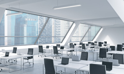 Fototapeta na wymiar Workplaces in a bright modern open space loft office. White tables equipped by modern laptops and black chairs. Singapoere panoramic view in the windows. 3D rendering.