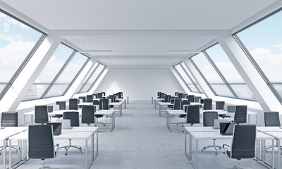 Workplaces in a bright modern open space loft office. White tables equipped by modern laptops and black chairs. New York panoramic view in the windows. 3D rendering.