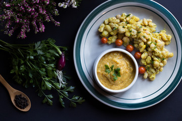 white beans and beans soup, with cherry tomato, and curcuma.