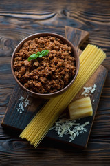 Ingredients for spaghetti bolognese, rustic wooden surface