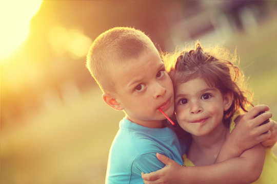 Brother And Sister In Hug With Love And Big Happy Smile. Shalow