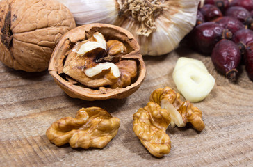Dried fruit of hawthorn, garlic and walnuts. The concept of alternative medicine.
